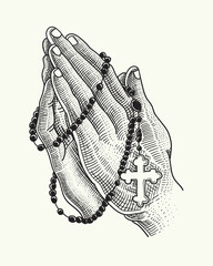praying hands with a rosary necklace

