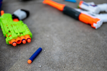 Soft foam dart gun loaded and ready for use by children.