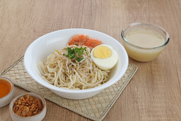 Mie Celor, a noodle dish from Palembang, South Sumatra, Indonesia. Served in a thick and savory shrimp broth with complements such as eggs, shrimp, bean sprouts, and celery.
