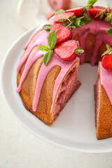 Dessert stand with delicious strawberry cake on light background, closeup