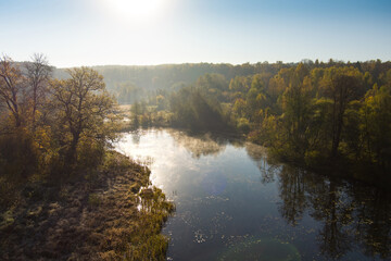 Fototapeta na wymiar Aerial early morning view of trees and river. Fall city park scenery in Vilnius, Lithuania