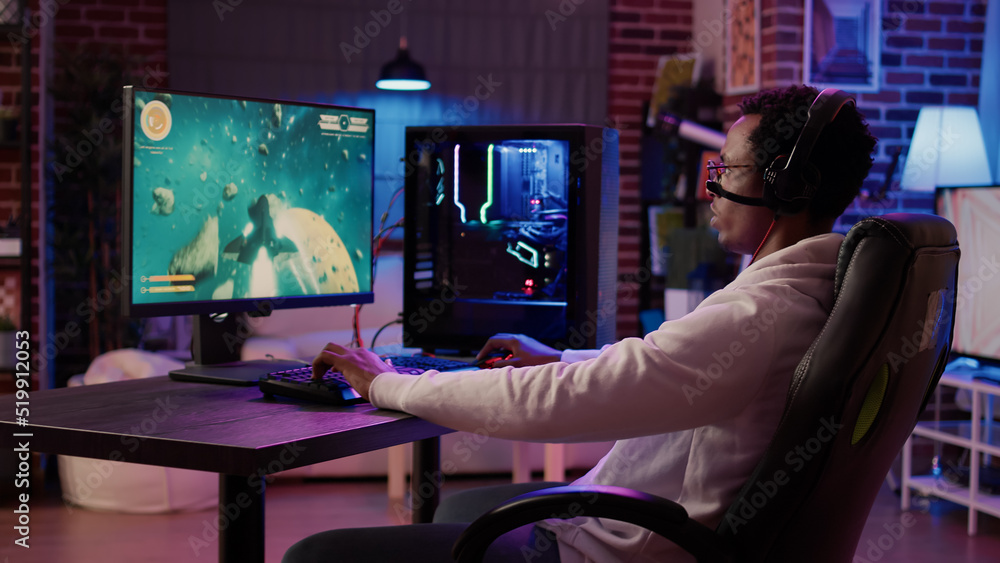Aufkleber closeup of african american man streaming online simulation game while talking in headset with team 