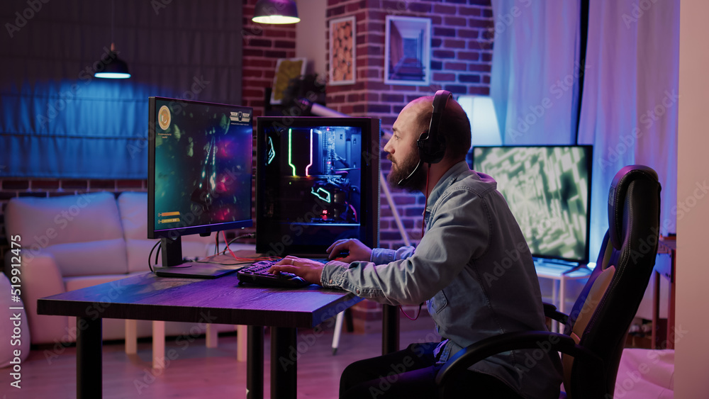 Aufkleber gamer streaming fast paced space shooter while explaining gameplay to subscribers in home living roo