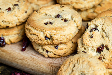 delicious dried cookies made of high-quality flour with dried red cranberries on the table