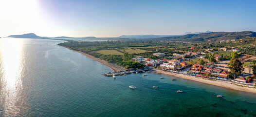 Naklejka premium Panoramic aerial view over Gialova seaside city in Navarino bay. It is one of the best touristic places located in Messenia, Greece.