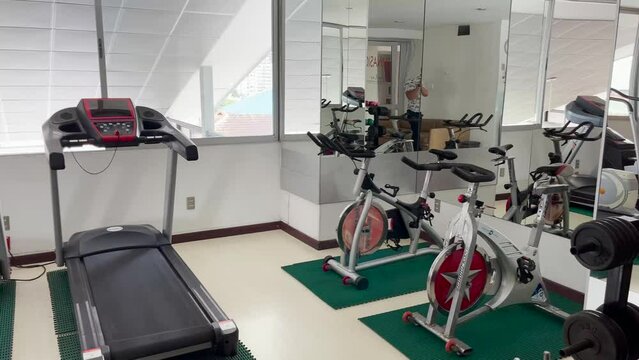 Exercise machines. Gym. Fitness. sports. Place to exercise. No people. Treadmill, Weights. Public gym.