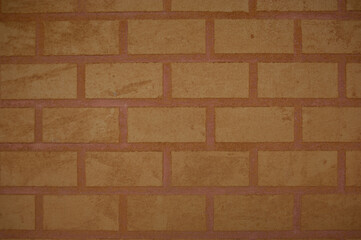 Background image of a wall made of red clay bricks.