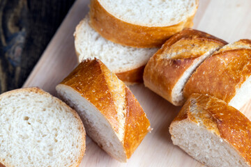 sliced into pieces a long baguette with a crispy crust