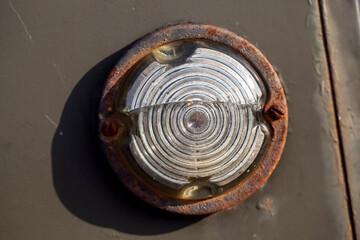old light bulb and glass to protect it in rust