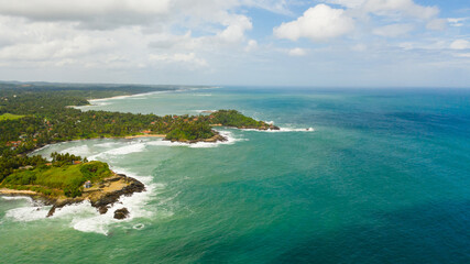 Aerial view of coast with hotels and beaches and the blue ocean. Sri Lanka.