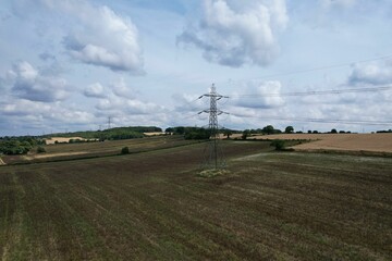 High Voltage Power Supply Poles with Cables Running Through British Farmlands and Countryside,...