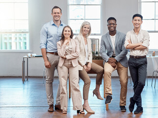 Team, unity and support in a modern office of diverse workers, smiling and looking confident....