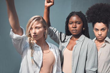 Diverse female activists or protesters fists up fighting for freedom and human rights. A group of black lives matter supporters raising awareness for the political liberal movement and social justice - obrazy, fototapety, plakaty