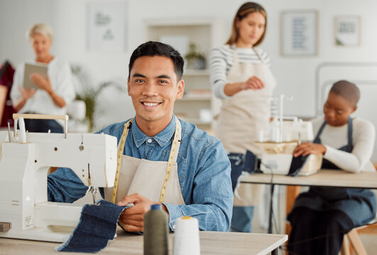 Fashion, design and style with a young designer working in a startup on a sewing machine in a workshop. Busy and creative designer creating new, trendy and fashionable clothes in a small business