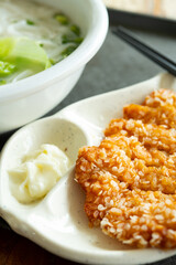 angle view flat rice noodles with deep fried chicken at vertical composition