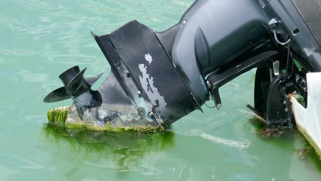Closeup of outboard motor on boat