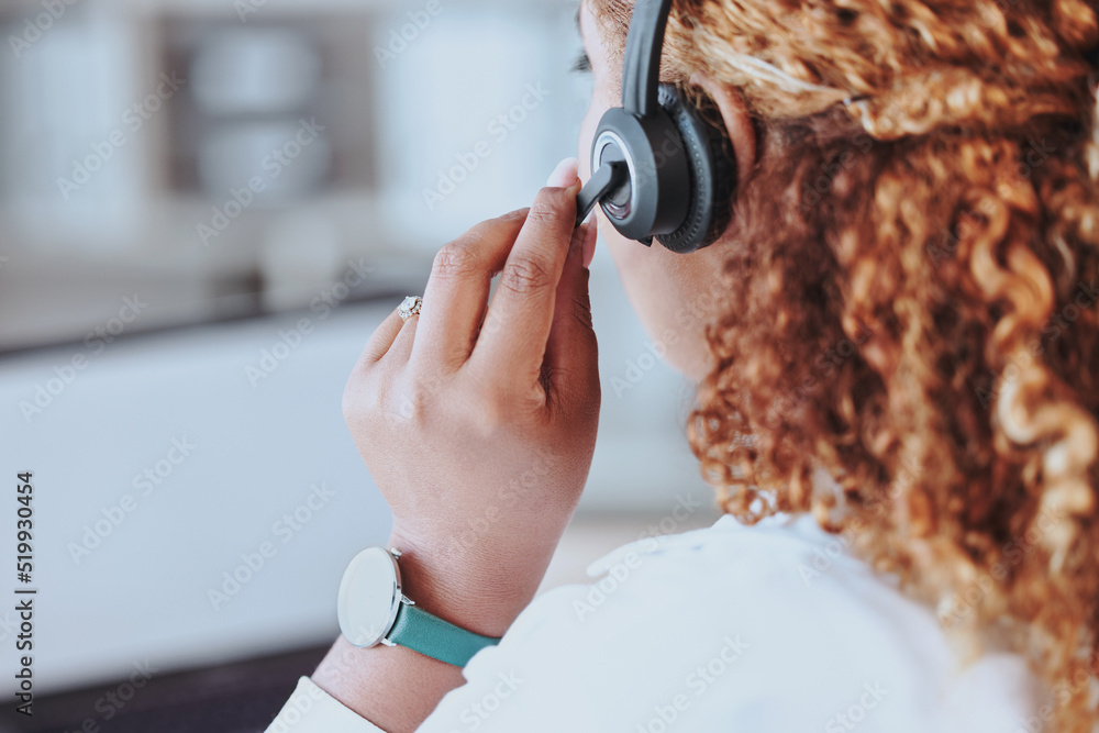 Aufkleber talking, advice, discussion being had by a call center agent wearing a headset in an office at work.