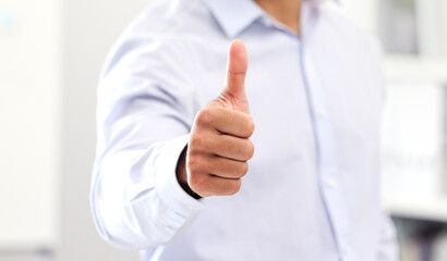 Thumbs up for celebrating success and good work, hand of business man, manager or entrepreneur showing hand gesture. Closeup sign and positive symbol of approval, agreement and trust on fingers