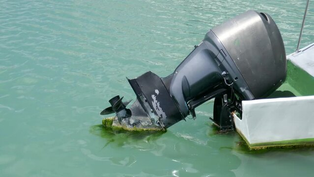Ocean waves drifting by outboard motorboat engine