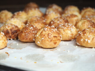 Chouquettes on baking tray