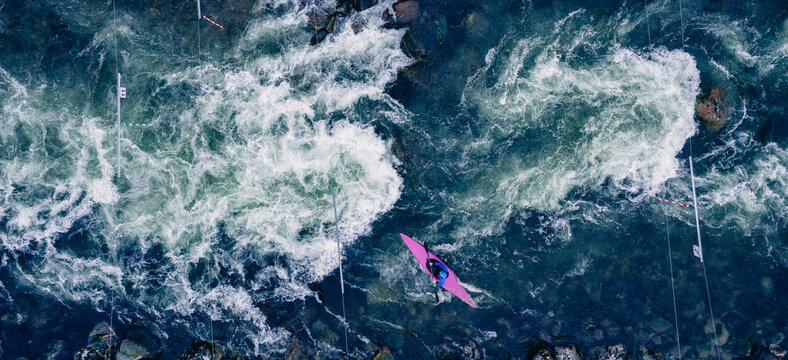 Aerial view extreme kayak boat rough river, sunny day. Concept overcoming obstacles and difficulties of life, self knowledge