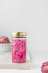Obraz na płótnie Canvas Pickled onions in a jar, red onions in vinegar, purple onions, Quick pickled red onions