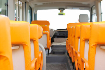 Inside a school bus with orange seats