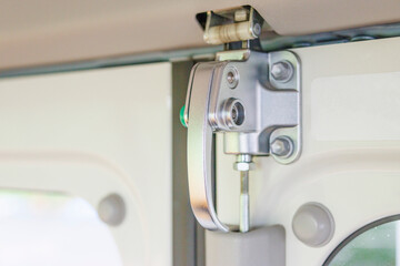 Image of a door cock of a Japanese minibus
