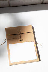 Cardboard brown volume envelope on a white background with copy space. Top view