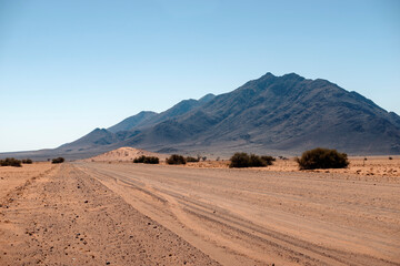 gravel road toward the mountain