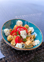 Crispy Eggpant Salad. Warm Salad of Tomatoes and Fried Eggplant with Herbs and Cream Cheese with Hot and Sweet Sauce. 