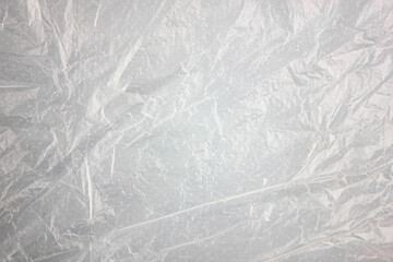 Authentic texture background of plastic light package. White, overprinted plastic bag background....