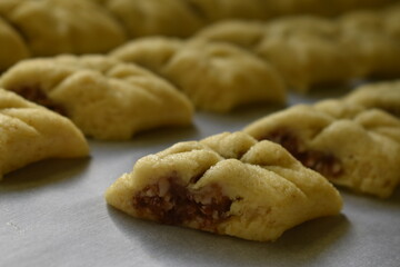 Baking Makrout. semolina, dates and honey sweets, traditional North Africa sweets, oriental sweets