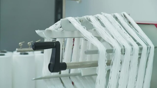 Closeup of polymer thread on the winding wheel, slow motion