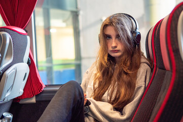 Portrait of a young teenager girl on a trip on a bus. Selective focus. Travel and tourism concept....