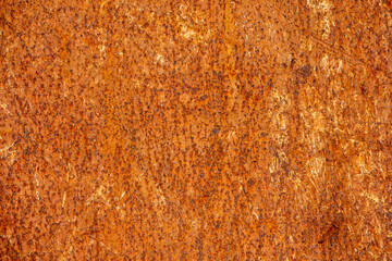 Old rusty metal surface. Abstract background for design purpose. Warm orange color. Random shapes.