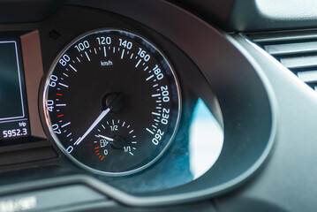 Modern car speedometer,odometer,tachometer and illuminated dashboard. car dashboard modern automobile controlilluminated panel speed display.Car instrument panel.Close up.Selective focus.