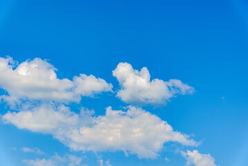 White fluffy clouds in the blue sky background.Cloudy white blue sky in the nice blue heaven sky.