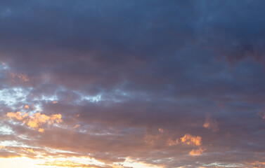 Naklejka na ściany i meble Clouds in the sky at sunset background.