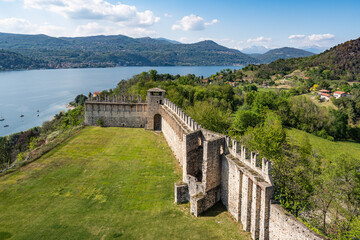 View from the Rocca di Angera with the walls of the castle and the Lake Maggiore in the background,...