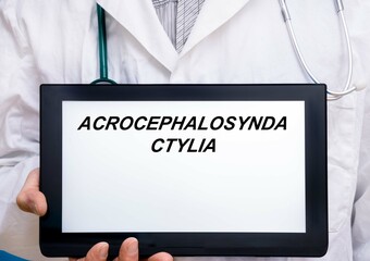 Acrocephalosyndactylia.  Doctor with rare or orphan disease text on tablet screen Acrocephalosyndactylia