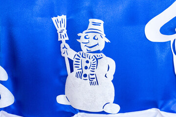 White snowman on a blue background. Winter design of the premises in the children's school