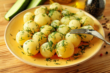 Concept of tasty food with boiled young potatoes, close up