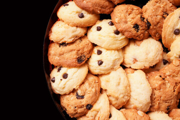 Top view of homemade Cashew nut with Butter and chocolate chip Cookies on black background with copy space