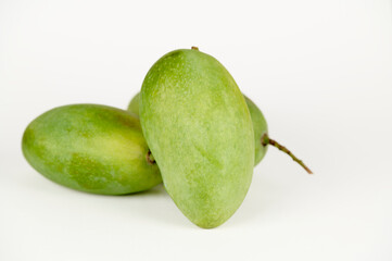Closeup view of three Langda mangoes (Magnifera indica) on a white background