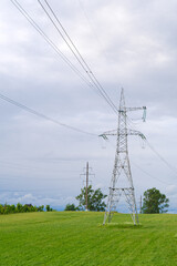 Power lines in a green field. sunny day