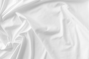 White fabric. luxurious white fabric texture background. Creases of satin, silk, and cotton.	