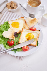 Fried Egg on Toast Bread and cup of fresh hot coffee on light grey background