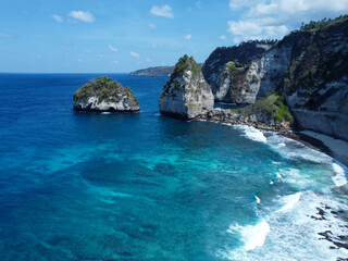 Aerial photo of Nusa Penida bay, white waves and crystal clear water