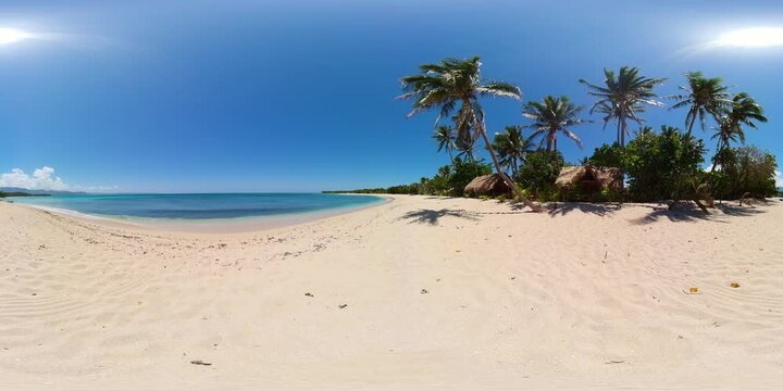 A tropical beach with palm trees and a blue ocean. Saud Beach, Pagudpud. Philippines. 360 panorama.